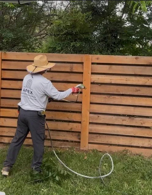 Restored and stained wooden fence on residential property